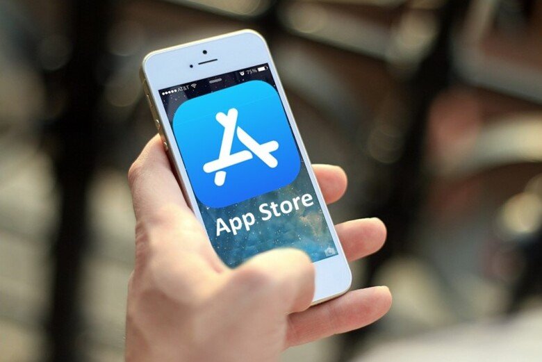 Person holding iphone which says appstore.