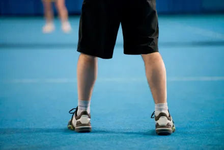 Feet on tennis court