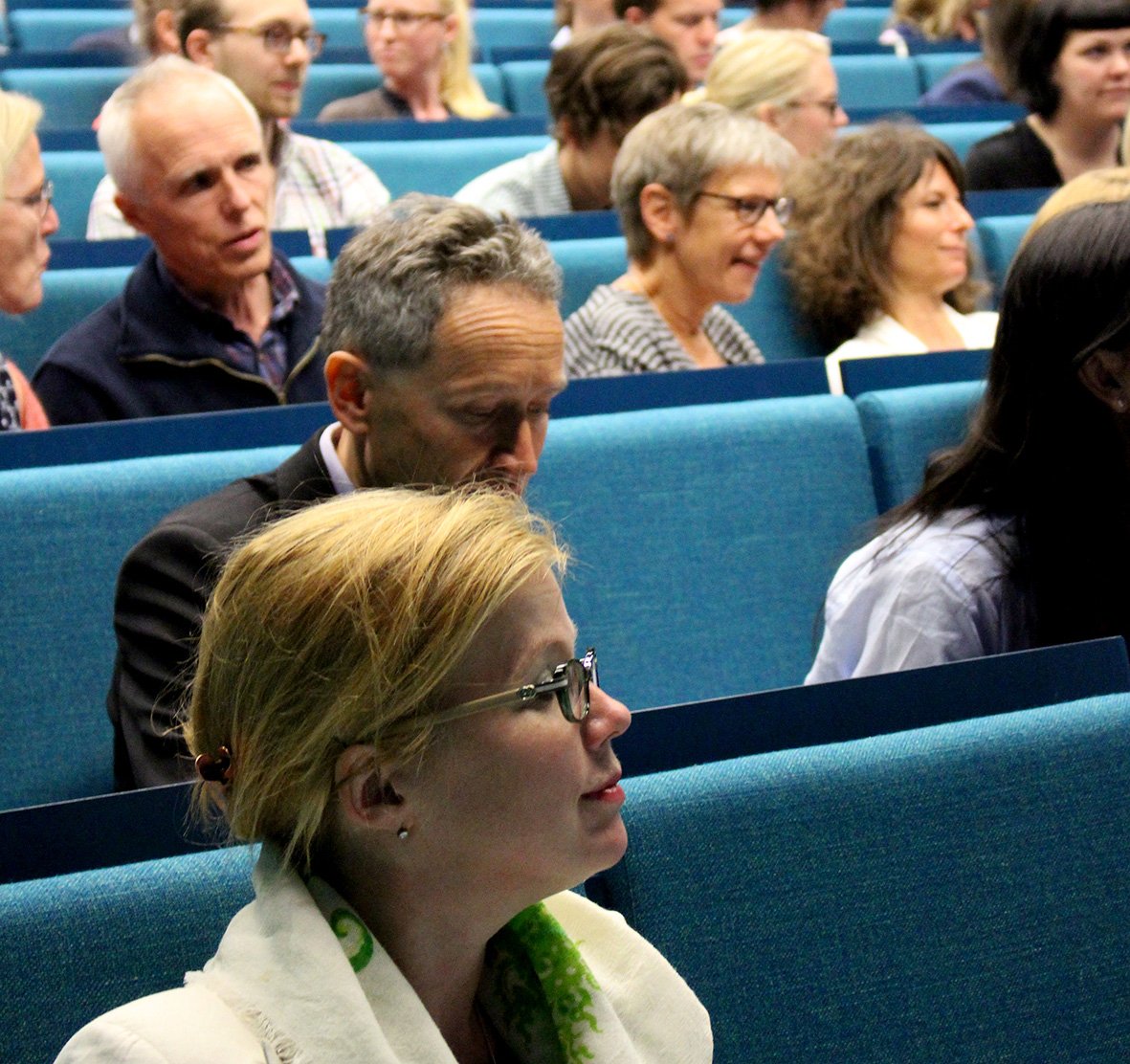 Researchers with the Department of Public Health Sciences gathered in a lecture hall.