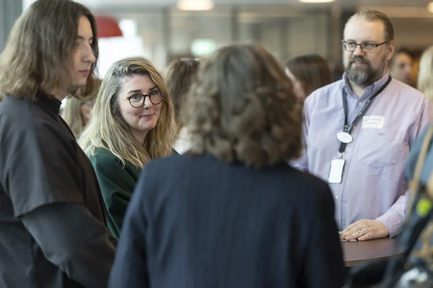 People in conversation during an event.