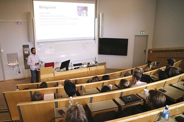 Students in the lecture hall listening