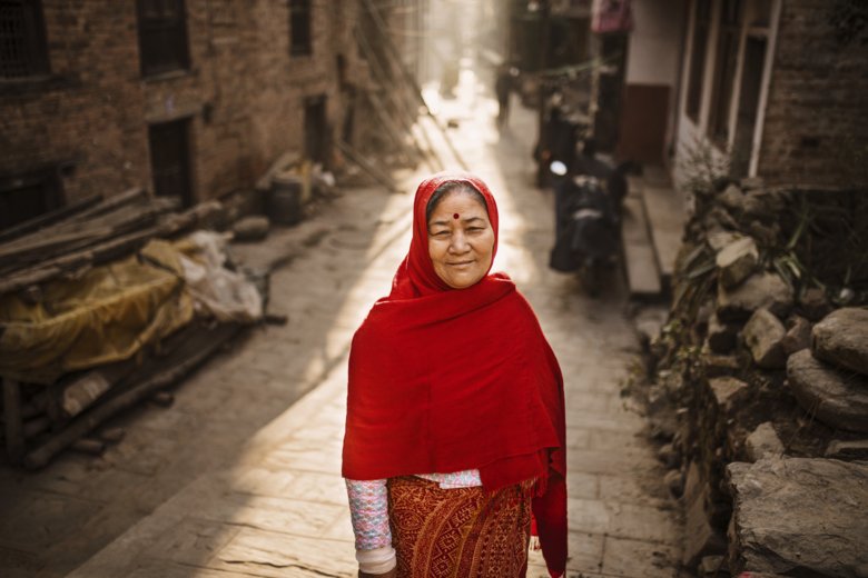 A woman from Nepal dressed in red