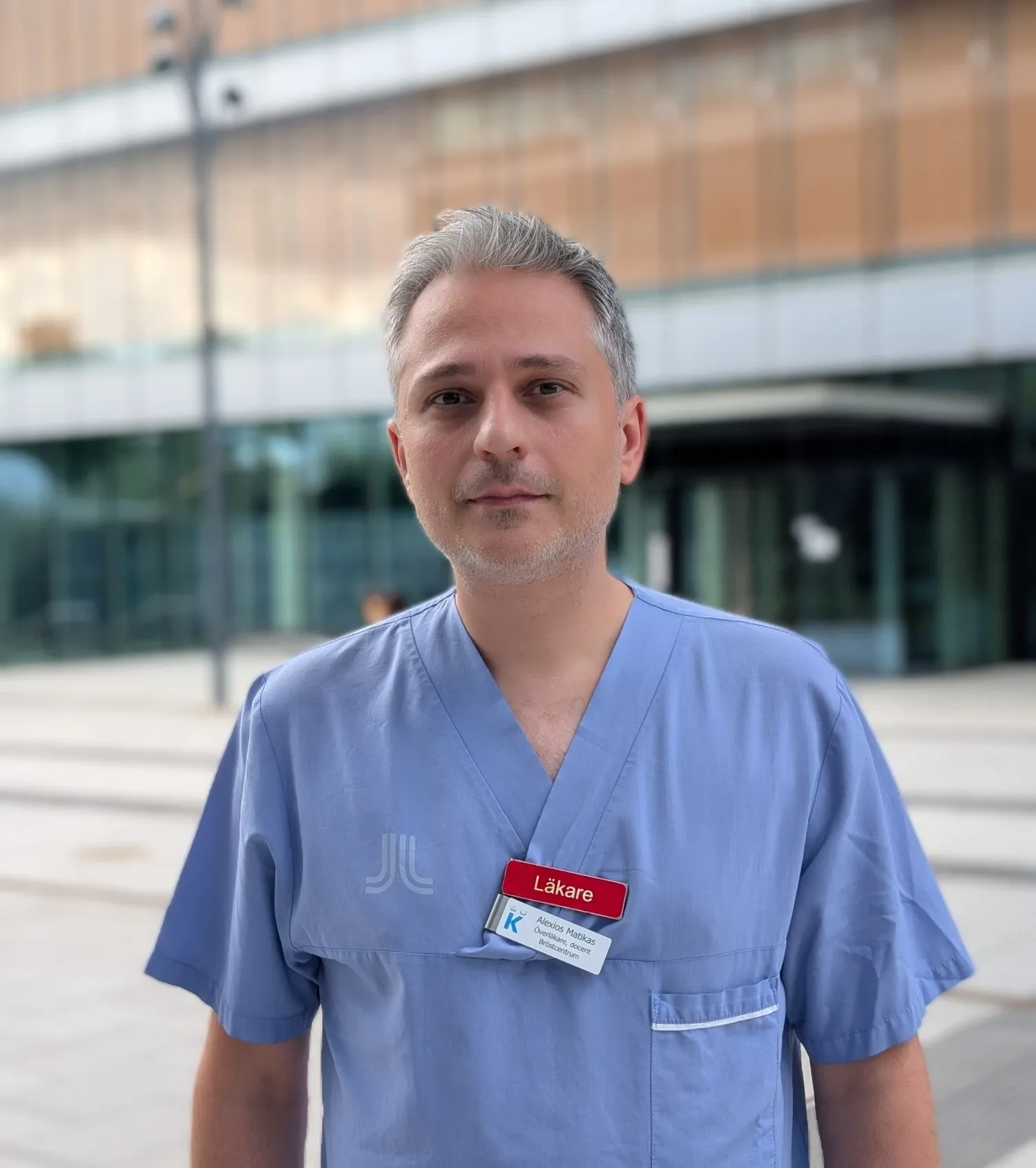 Portrait of Alexios Matikas in blie scrubs