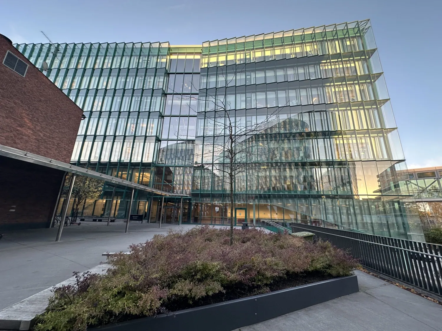 Different views of the building from outside and inside. Biomedicum's facade viewed from Aula Medica.