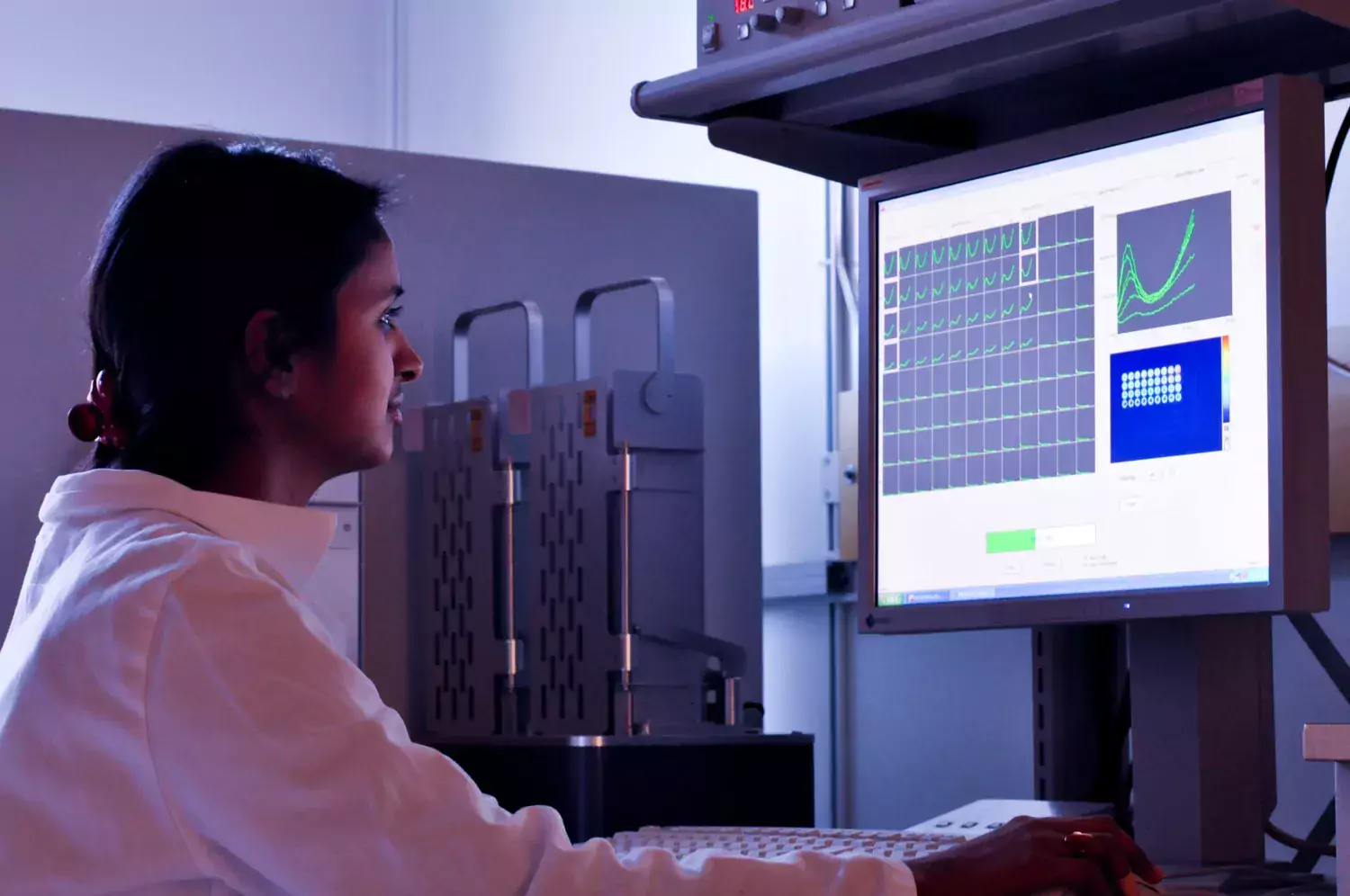 Genre image showing woman in front of a computer.