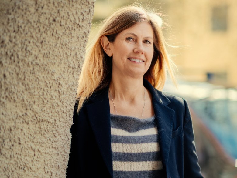 Portrait of Celilia Fridén wearing a striped shirt.