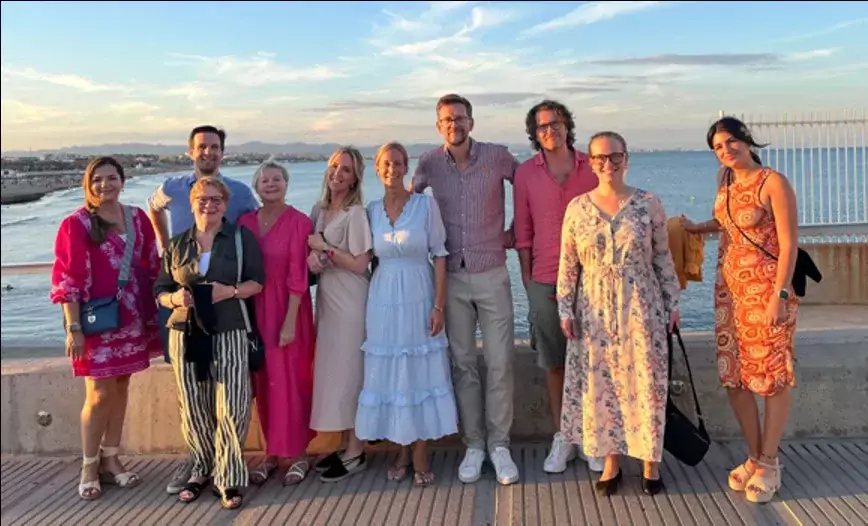 Group of people in front of the sea