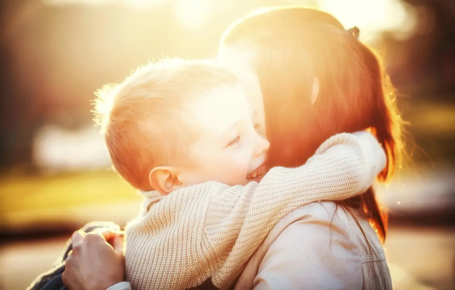 Mother and child hugging