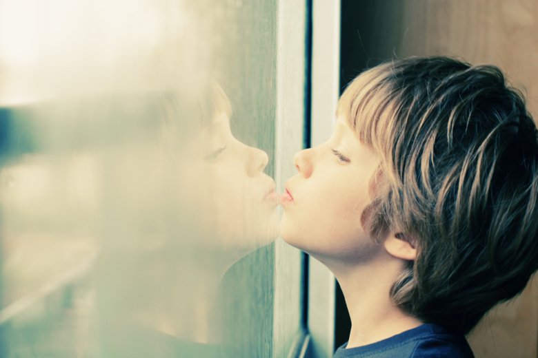 A boy looking out of a window