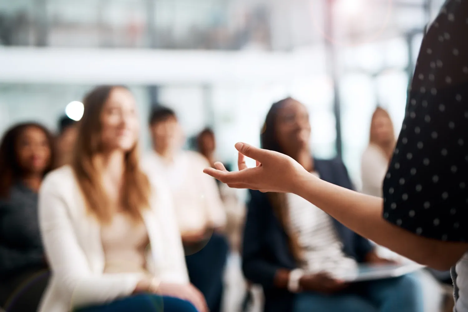 Woman lecturing for an interested audience