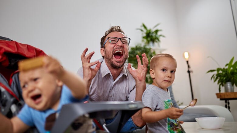 Image of a parent screaming nearby his two children.