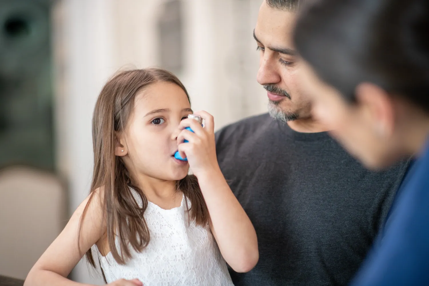 Girl with asthma inhalator