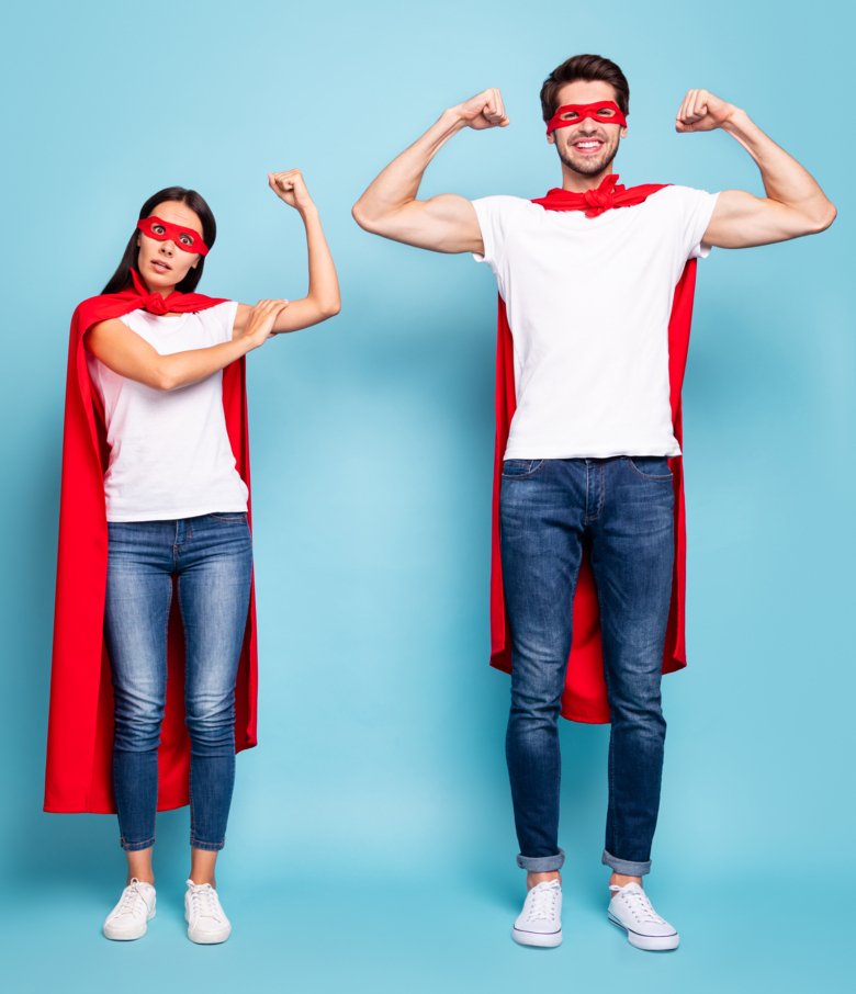 Picture of two parents dressed as superheroes.