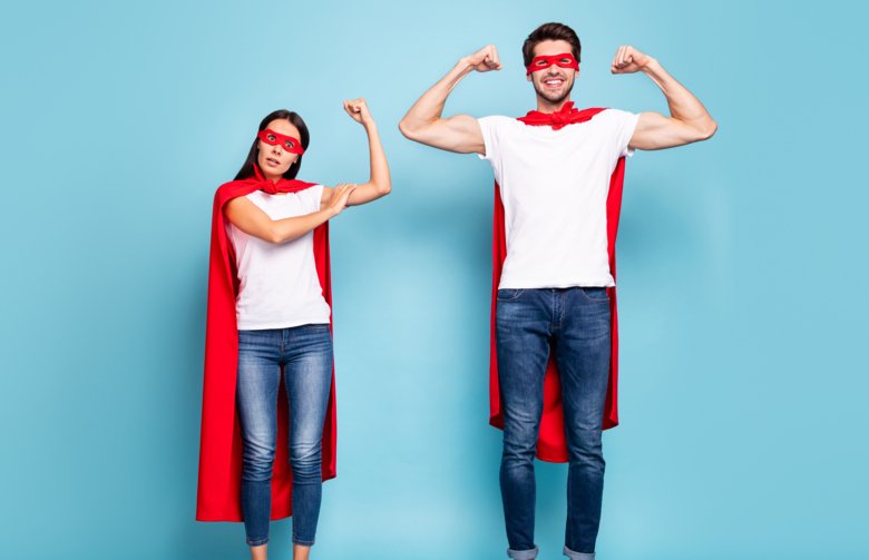 Picture of two parents dressed as superheroes.