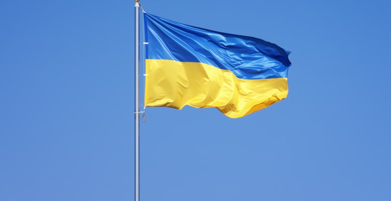 Ukraine's flag against a blue sky.