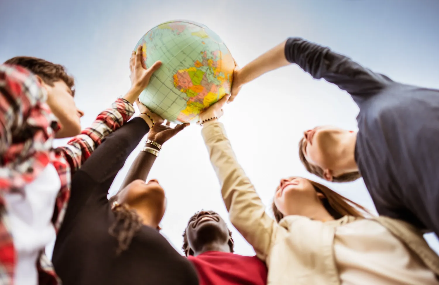 People holding a globe