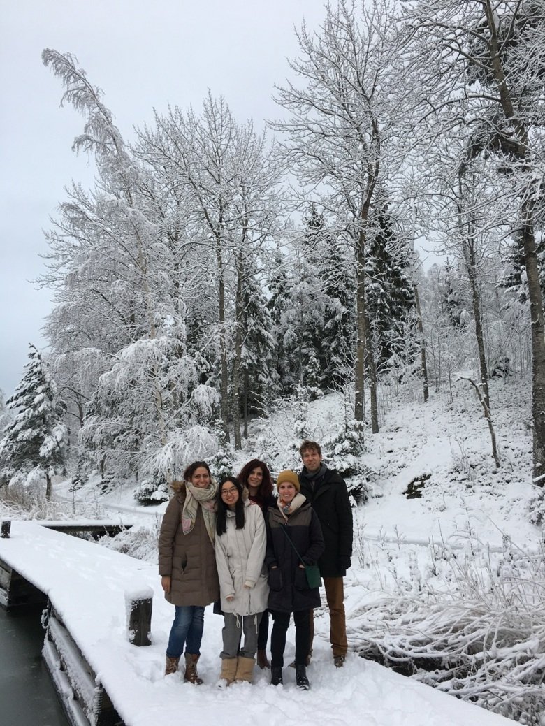 group photo of some people standing in a snowy landscape