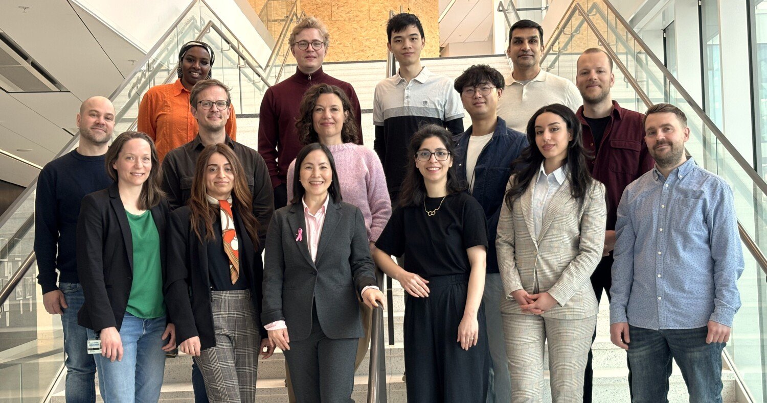 Research group photographed on a staircase