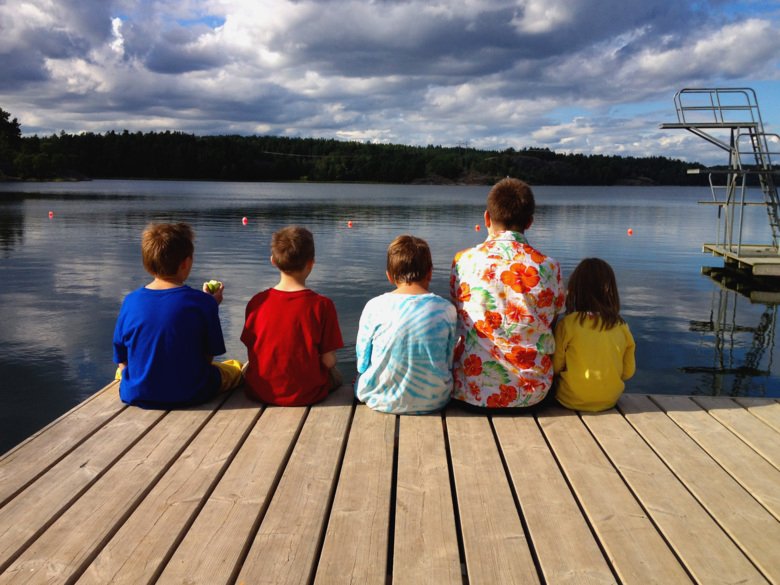 Youth sitting by the water