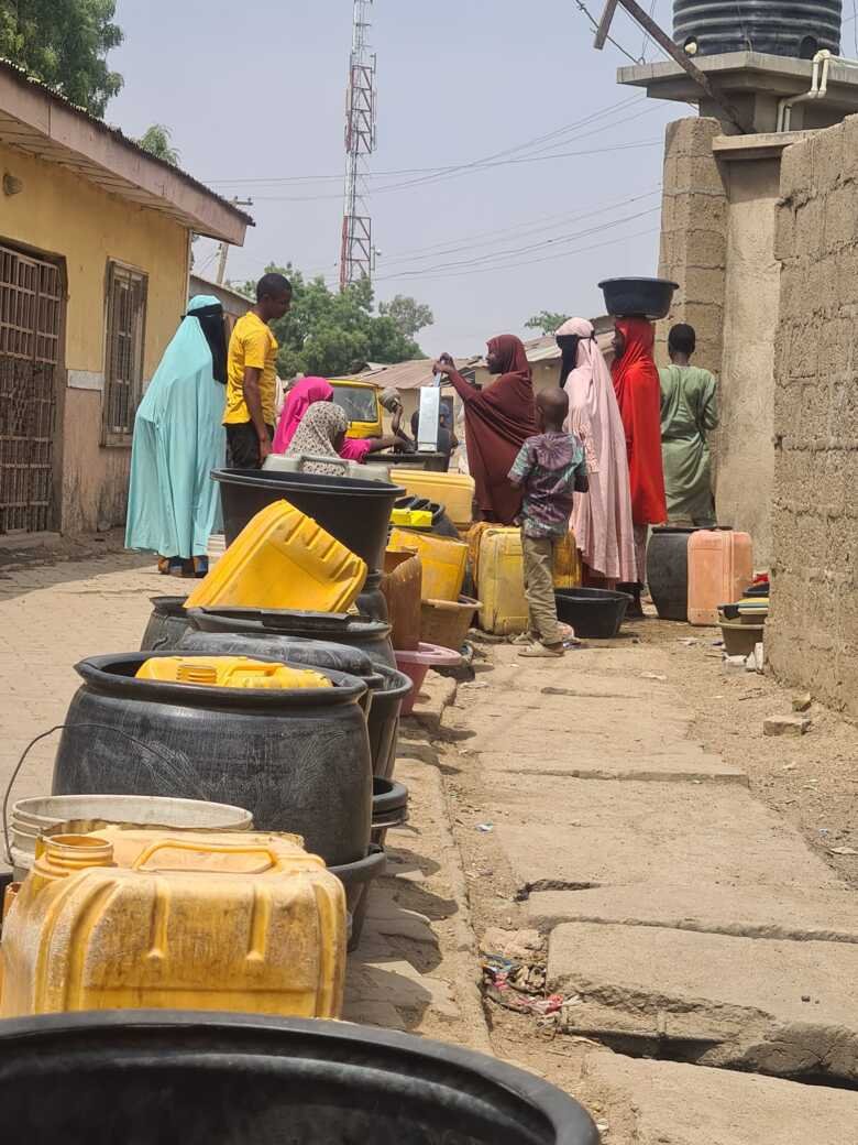 People on the street in north Nigeria getting water