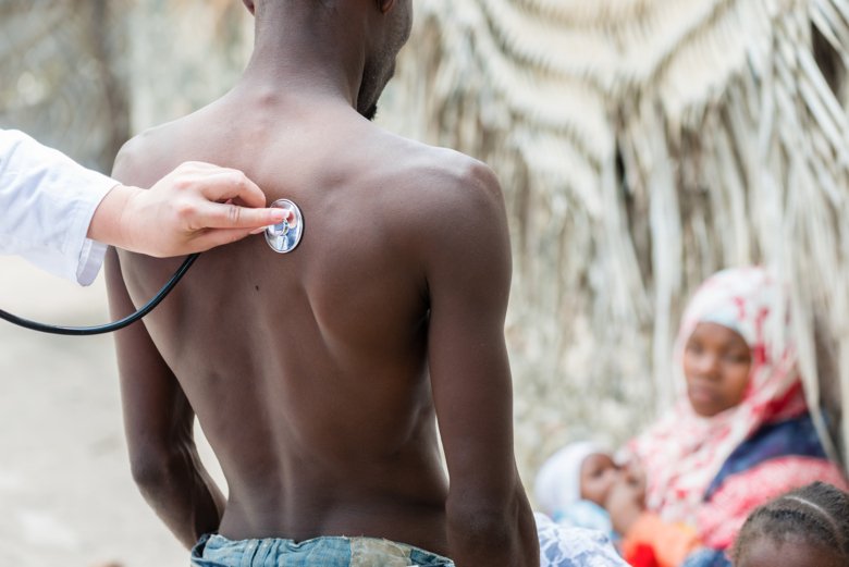 Doctor examining patient in Tanzania