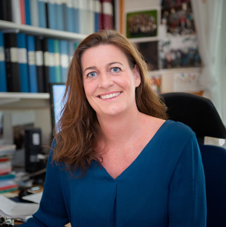 Picture of Sophie Bensing in her office, smiling at the kamera.