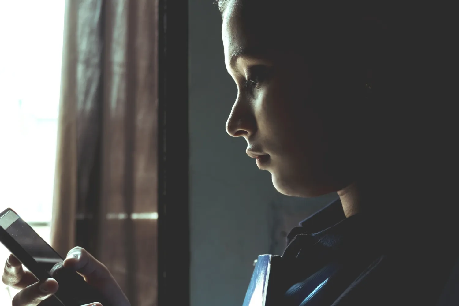 An Indian woman holding a mobile phone