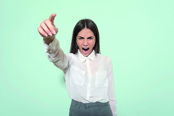 Angry woman pointing, credit: Getty Images.