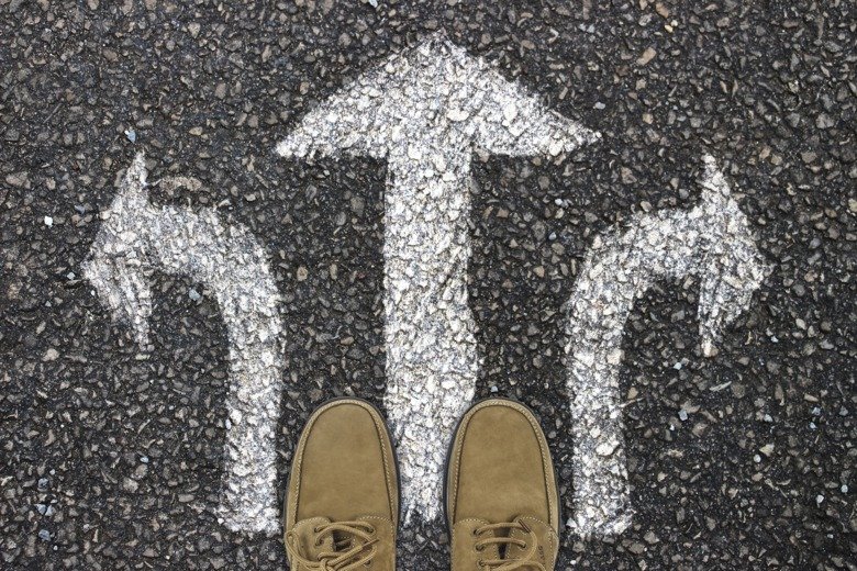 shoes on street with arrows