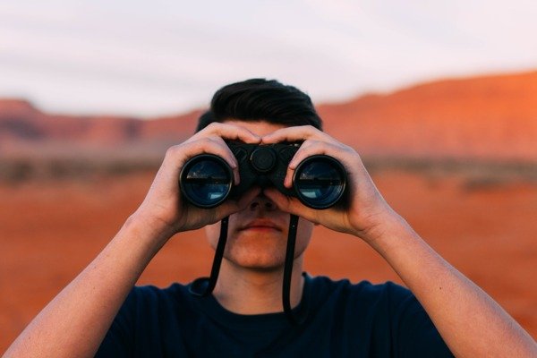 Man with binoculars, credit: Pixabay CC0.