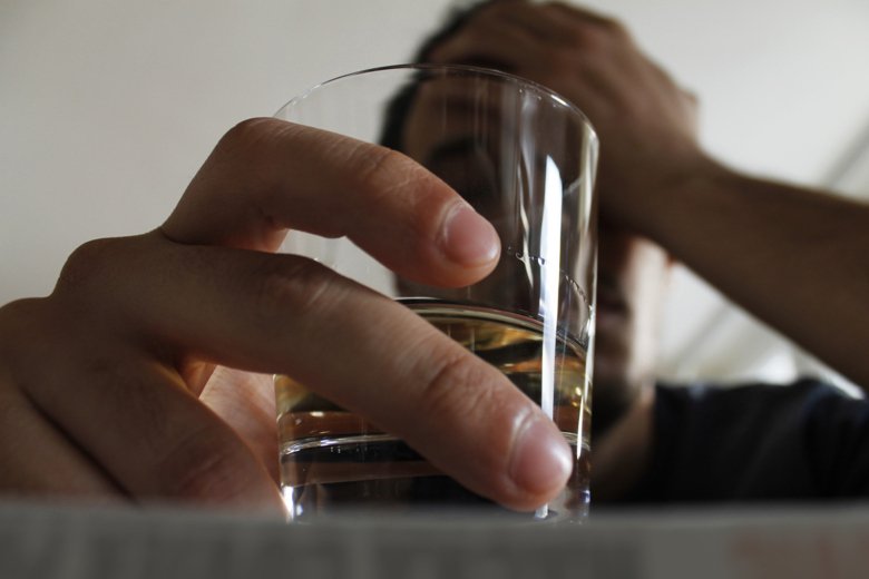 Photo of man with drinking glass.