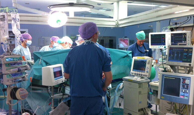 surgical procedure with nurses and surgeons.