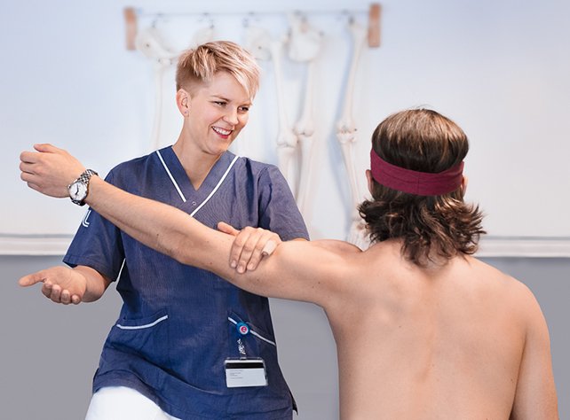 student helping patient