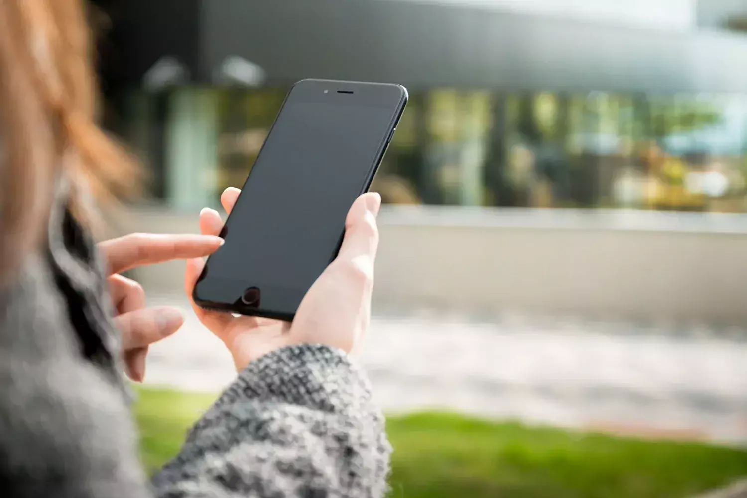 Hands holding a mobile phone