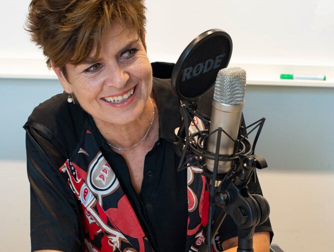 Ullakarin in front of a microphone.