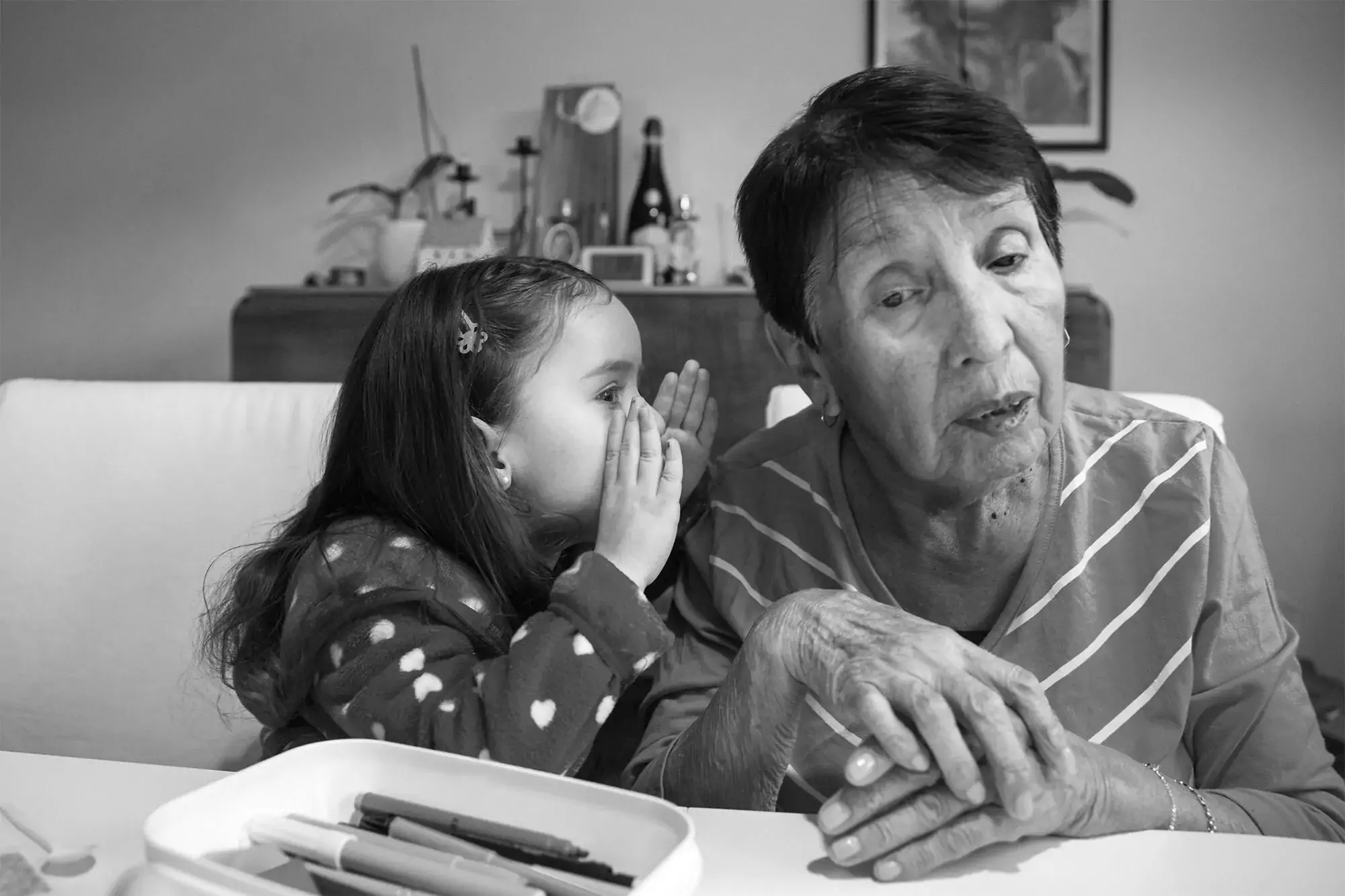 Adriana, 84, playing with a child.