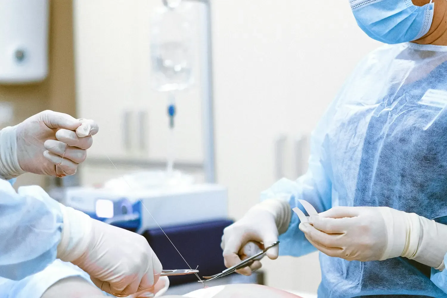 two surgents in a operating room