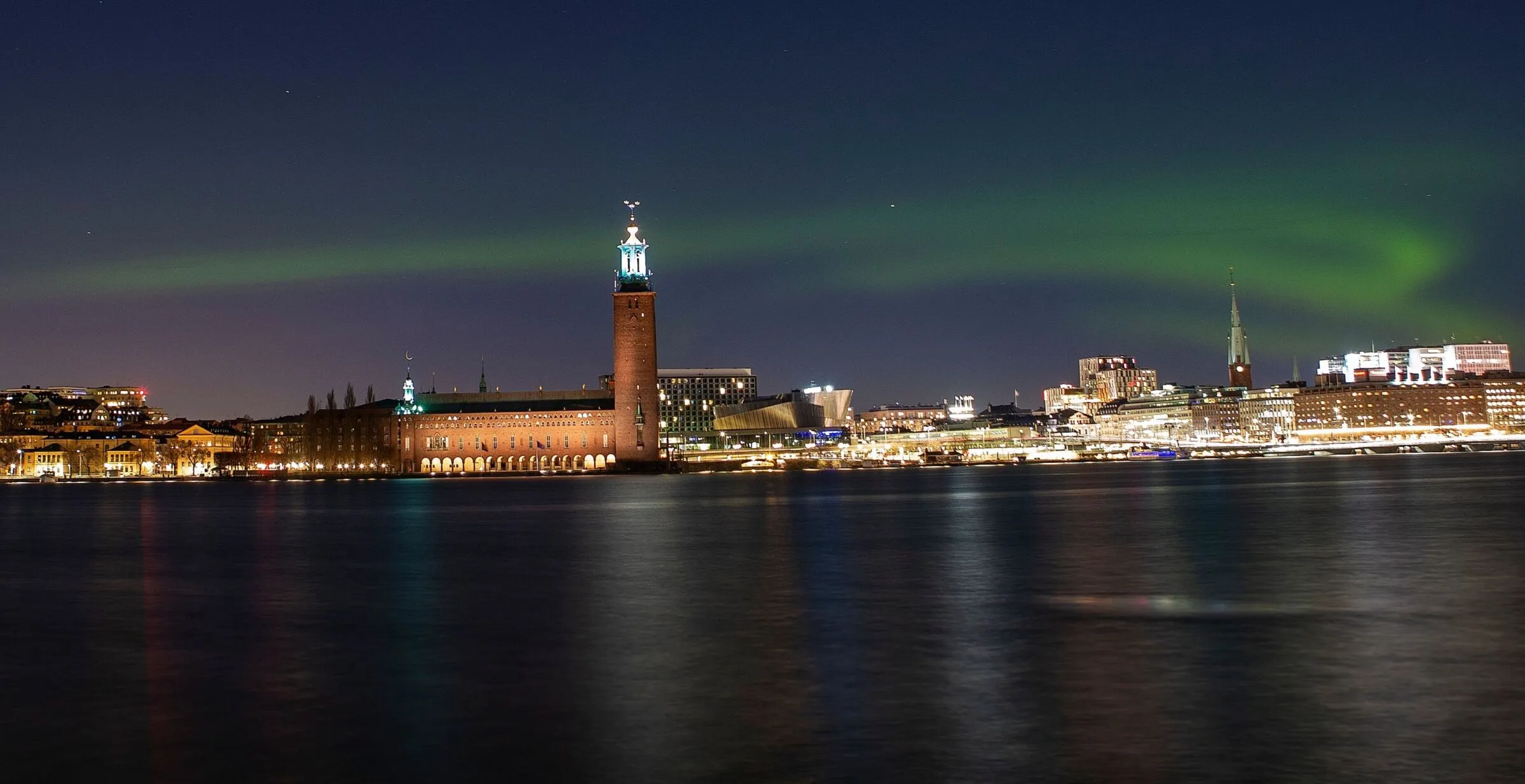 Northern light over Stockholm city and the City Hall