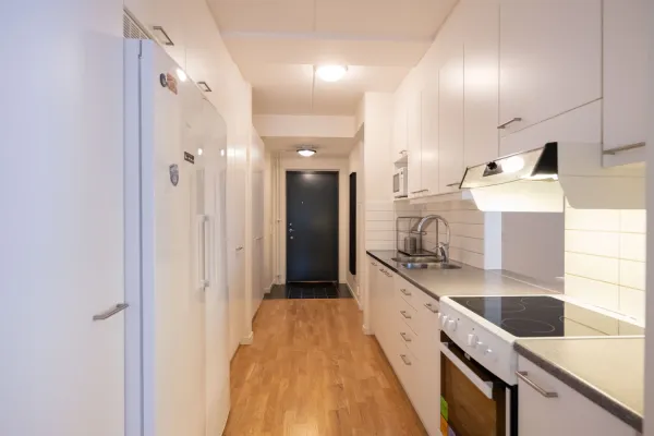 Picture of common kitchen and hallway in shared 4-bedroom apartment, KI Residence Flemingsberg.