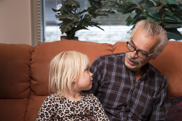 Karl-Erik, 76, playing with his grandchild. Collaboration between ARC and Fotoskolan STHLM 2019.