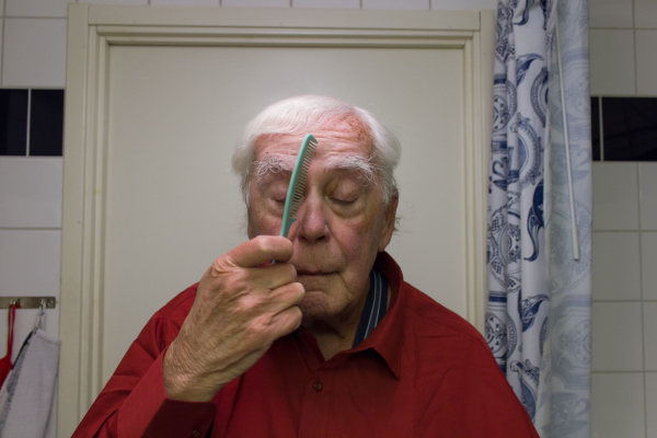 Bengt, 86, combing his eyebrows in front of the bathroom mirror. Collaboration between ARC and Fotoskolan STHLM 2019.