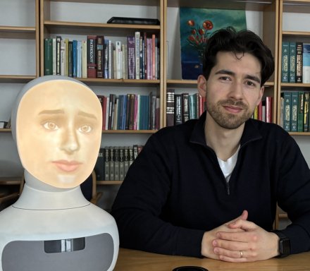 Male researcher and social robot