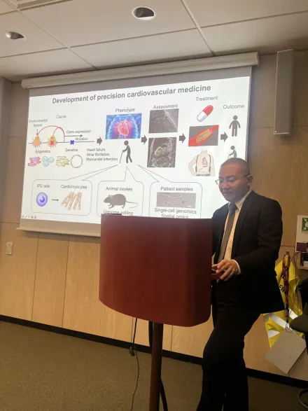 A man standing having a presentation.