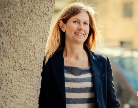 Portrait of Celilia Fridén wearing a striped shirt.