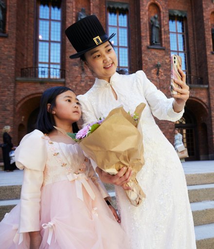 New doctor Jieln Lin with her daughter Yiyi Li outside Stockholm City Hall.