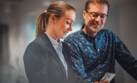 A woman and a man in profile.