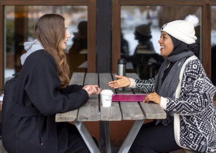 Students outdoors at campus Solna on a snowy winter's day.